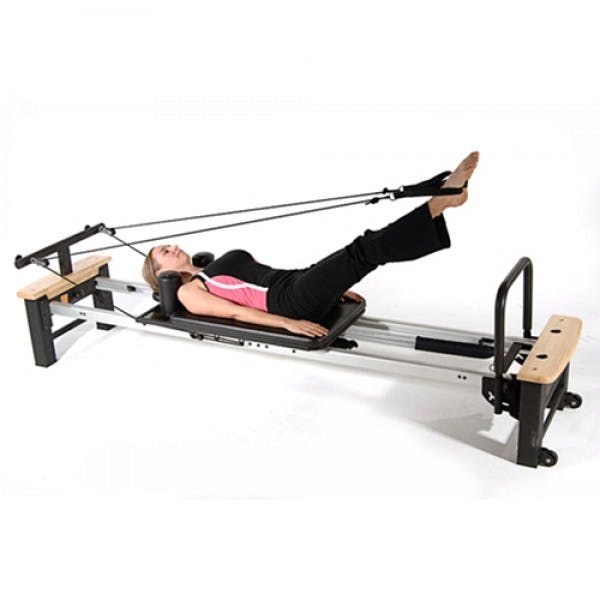 Pilates with Machine: What is Reformer Pilates? - Yottled